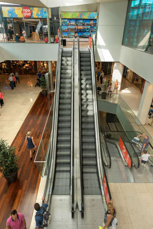 Interior of the Maremagnum or Mare Magnum, large shopping mall with escalators, famous leisure center with shops and restaurants built at Port Vell area in Barcelona. Catalonia, Spainのeditorial素材