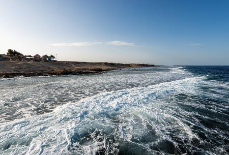 Coastline of the Red Sea near Marsa Alam, Egypt, Africa. The waves crash on the coral reef