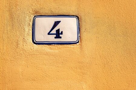 Old house number four on the orange wall, Bologna downtown, Emilia-Romagna, Italy, Europeの写真素材