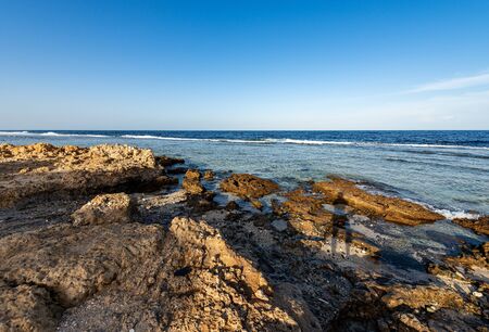 Red Sea near Marsa Alam, Egypt, Africa. Seascape with waves breaking on the coral reef