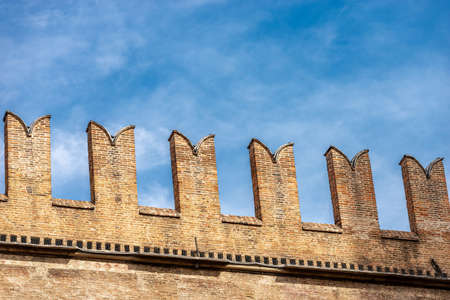 Closeup of the medieval Palazzo Re Enzo (King Enzo palace, 1245) with the battlements (merlons), in...