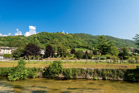 Borgo Valsugana, small village in Sugana valley, with the river Brenta and the Castel Telvana,...