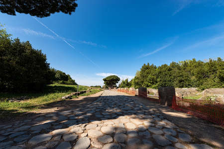 Decumanus Maximus, ancient Roman road in Ostia Antica, colony founded in the VII century BC. Archeological siteÂ in Romeの写真素材