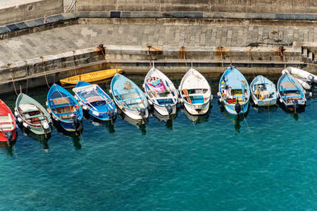The harbor of Vernazza village with small boats, Cinque Terre, Mediterranean Sea, La Spezia...