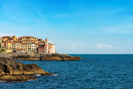 Ancient village of Tellaro and Mediterranean sea with the church of San Giorgio (St. George) in the Gulf of La Spezia, Lerici, Liguria, Italy, Europeのeditorial素材