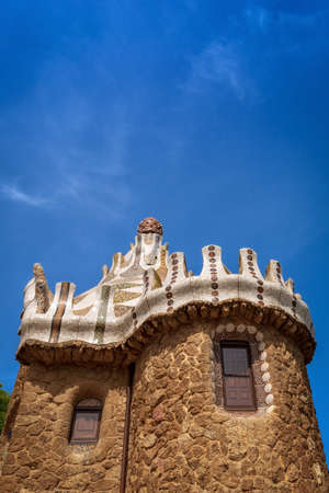Stone house with mosaic roof in the famous Park Guell (Parc Guell 1900-1914), designed by Antoni Gaudi (1852-1926). UNESCO World Heritage Site in Barcelona, Catalonia, Spain, Europeのeditorial素材