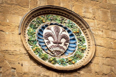 Closeup of the Church of Orsanmichele in gothic style (1337-1380), medallion with the symbol of the city of Florence by the artist Luca della Robbia. Tuscany, Italy, Europeの写真素材