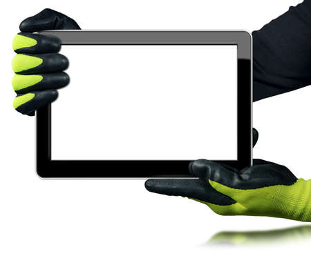 Manual Worker with protective work gloves showing a blank digital tablet computer. Isolated on white background with copy space and reflection.の写真素材