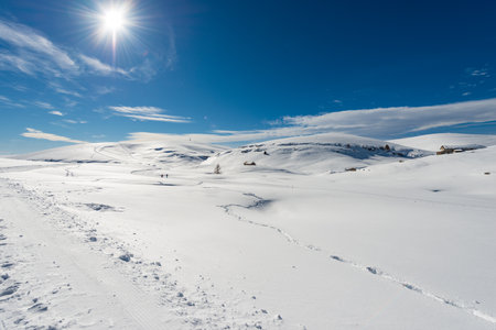 Lessinia High Plateau (Altopiano della Lessinia) and the Tomb Mountain (Monte Tomba) in winter with snow, Regional Natural Park, Malga San Giorgio ski resort in Verona province, Veneto, Italy, Europe.の写真素材