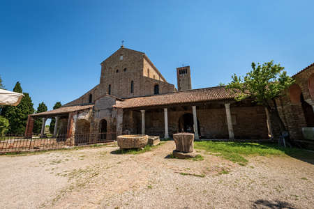 Facade of the Basilica and Cathedral of Santa Maria Assunta in Venetian-Byzantine style (639) in Torcello island, one of the oldest churches in Venice,   Veneto, Italy.の写真素材