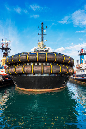Close-up of a group of tugboats, view from the bow of the boat. International port in the Gulf of La Spezia, Liguria, Italy, Europe.の写真素材