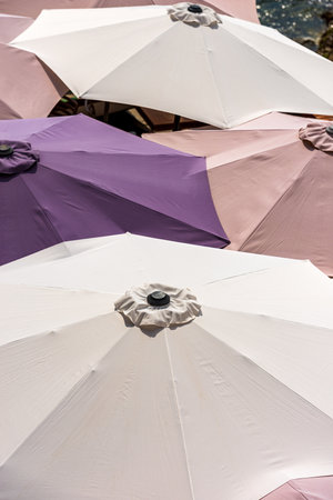 Close-up of a group of colorful beach umbrellas, view from above, photography full frame. Beach holiday or UV protection concept.の写真素材