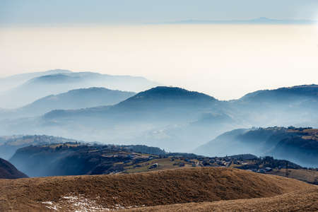 Winter landscape of the Lessinia plateau (Altopiano della Lessinia) and the Padana Plain or Po...