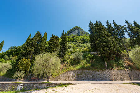The hill called Rocca di Garda, on the coast of Lake Garda (Lago di Garda) with the pedestrian and bicycle lane in front of the small village of Garda, Verona province, Veneto, Italy, southern Europe.の写真素材