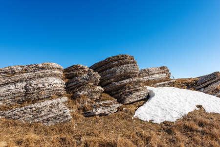 Beautiful rock karst formations on clear blue sky in Lessinia Plateau Regional Natural Park (Altopiano della Lessinia), in Verona Province, Erbezzo, Veneto, Italy, Europe.の写真素材
