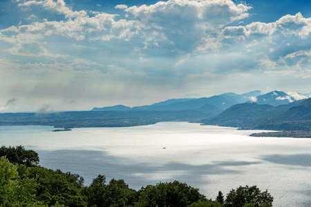 Aerial view of Lake Garda (Lago di Garda) seen from the Baldo Mountain (Monte Baldo), San Zeno di Montagna municipality, Verona province, Veneto, Italy, southern Europe. On horizon the Lombardy coast.の写真素材