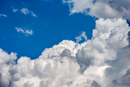 Beautiful storm clouds, cumulus clouds or cumulonimbus against a clear blue sky. Photography, Full...