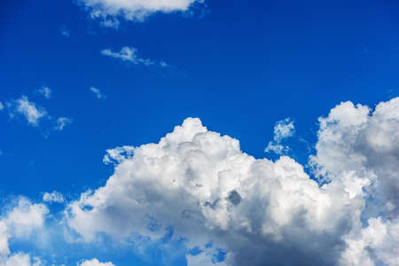 Beautiful storm clouds, cumulus clouds or cumulonimbus against a clear blue sky. Photography, Full frame.の写真素材