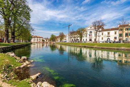 Cityscape of Treviso downtown with the river Sile with the street called Riviera Garibaldi and the small bridge called Ponte Dante. Veneto, Italy, Europe.の写真素材
