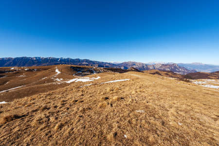 Lessinia Plateau Regional Natural Park (Altopiano della Lessinia) with the mountain range of Monte...