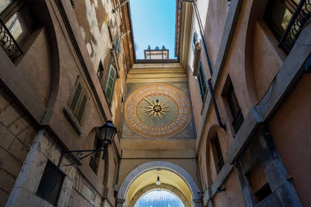 Brescia downtown. Bell and clock tower in Renaissance style, 1540-1550, in Loggia town square...