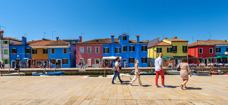 Beautiful cityscape of Burano Island with multi colored houses, small canal with moored boats, Venetian lagoon, Venice, UNESCO world heritage site, Veneto, Italy, Europe.のeditorial素材