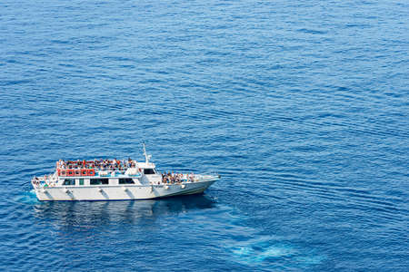 White ferry boat crowded with tourists, in motion in front of the ancient village of Vernazza. Cinque Terre National park, Liguria, La Spezia, Italy, Southern Europe.のeditorial素材