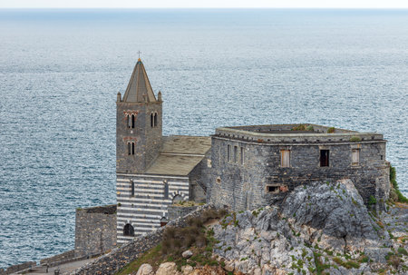 Medieval church of Saint Peter (San Pietro, V-XIII century) in Romanesque Gothic style. Portovenere or Porto Venere town, UNESCO world heritage site. Gulf of La Spezia, Liguria, Italy, Europe.のeditorial素材