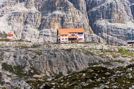 Alpine Mountain Hut in Sesto or Sexteen Dolomites called Rifugio Antonio Locatelli in front of Tre Cime di Lavaredo. Mountain range of Tre Scarperi. Bolzano, Dobbiaco, Trentino-Alto Adige, Italy.のeditorial素材