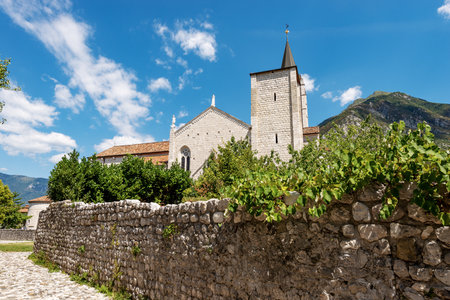 Medieval Cathedral of Venzone. Church of St. Andrew the Apostle, 1308. Destroyed by the 1976 earthquake and rebuilt between 1988 and 1995. Udine province, Friuli-Venezia Giulia, Italy, Europe.の写真素材