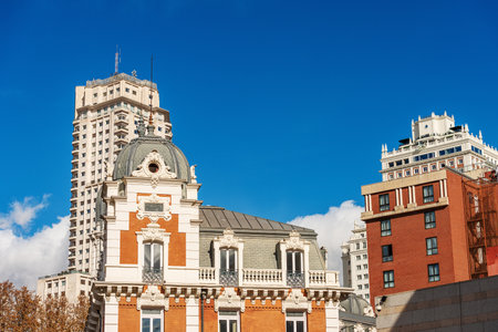 Urban skyline in Plaza de Espana (Spain Square) with the beautiful building of the Belgian Royal Asturian Company of Mines, 1899, designed by Manuel Martinez Angel. Madrid downtown, Spain, Europe.のeditorial素材