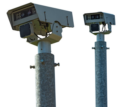 Close-up of a modern speed camera (traffic speed monitoring camera). Isolated on white background,...