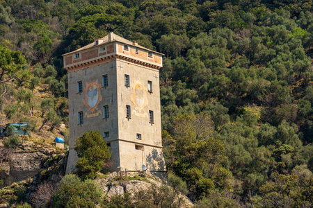 Ancient Andrea Doria tower (Torre Andrea Doria, 1562), built to defend the bay of San Fruttuoso from attacks by corsairs. Portofino and Camogli, Genoa province (Genoa), Liguria, Italy, Europe.のeditorial素材