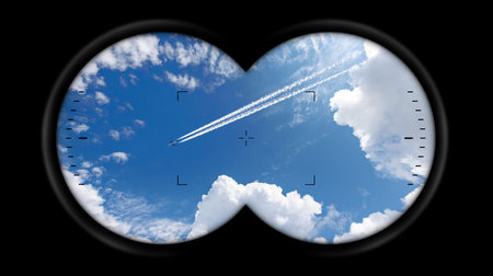 Binoculars Point of View with an airliner with contrails flying in a clear blue sky with beautiful...