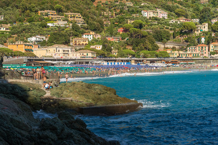 Bonassola beach crowded with tourists on a sunny summer day, small town and tourist resort in Ligurian coast. La Spezia province, Liguria, Italy, Europe.のeditorial素材