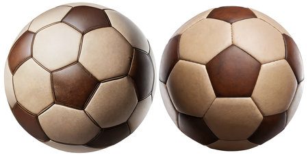 Close-up of two old brown and white soccer balls, isolated on white background.の素材