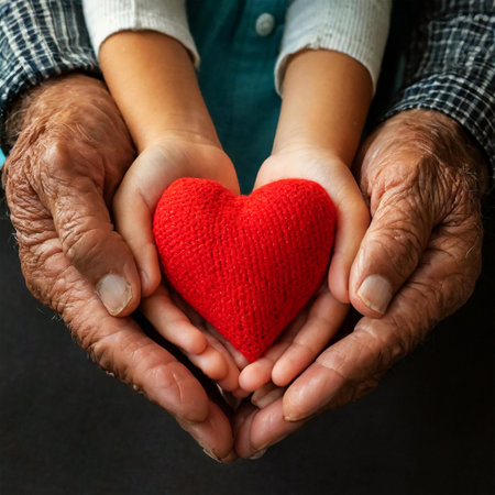Closeup of grandfather and granddaughter holding hands and holding a red heart. Cupped hands of an adult and a child holding a red fabric heart. Concept of love, care and comfort. Generative Ai.の素材