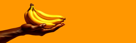 Extreme close up of a male hand holding ripe yellow bananas in the palm of his hand isolated on a yellow-orange background with copy space, wide blank banner. Generative Ai.の素材