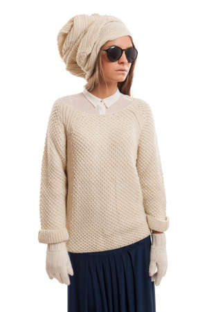 Sophisticated female model wearing a turban, white gloves, blue skirt, and black sunglassesの写真素材