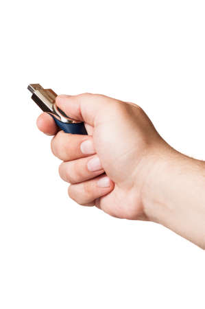A hand and an usb flash memory stick on a white background isolatedの写真素材