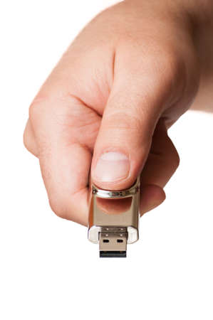 Male hand and a business usb flash drive isolated on a white backgroundの写真素材