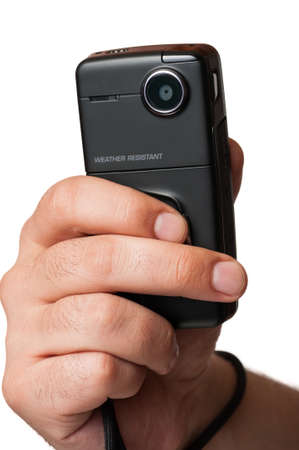 Closeup of a mini video camera, water resistant, held in hand and isolated on a white backgroundの写真素材