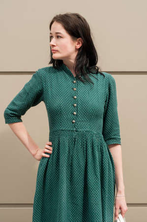 Young female model with a natural look having one hand on the hipの写真素材