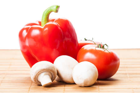 Tomatoes, red pepper, and white mushroomsの写真素材