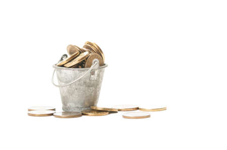 Bunch of romanian golden coins in a small bucket isolated on white backgroundの写真素材