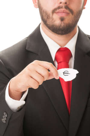 Euro money symbol concept using a man wearing a black suit and red necktie and holding a piece of paper with the euro money symbol on it.の写真素材