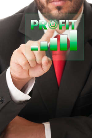 Business man click button to activate profit chart or bars on a high tech touch screen.の写真素材