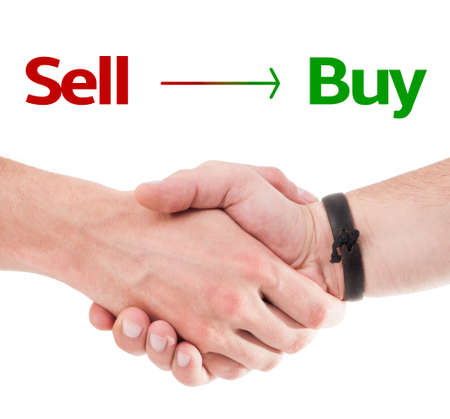 Sell Buy concept concept using 2 hands shaking isolated on white backgroundの写真素材