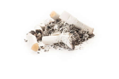 Dirty smelly cigarette ash and stumps or butts, isolated on white background