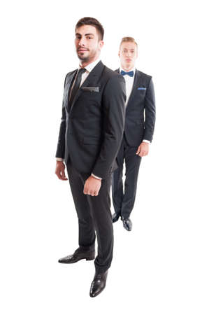 Two suited male models wearing necktie and bowtie, Business men concept.の写真素材
